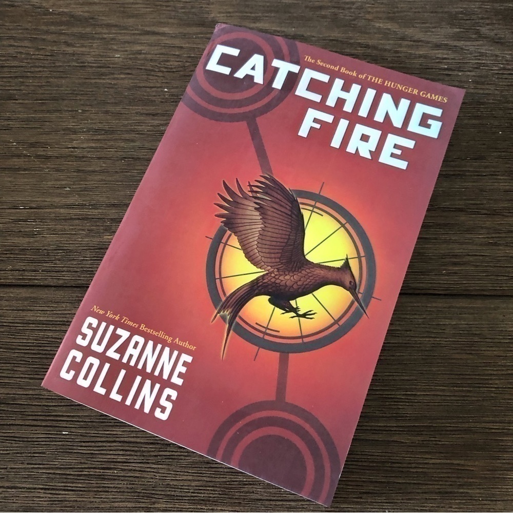 Catching Fire by Suzanne Collins paperback book
